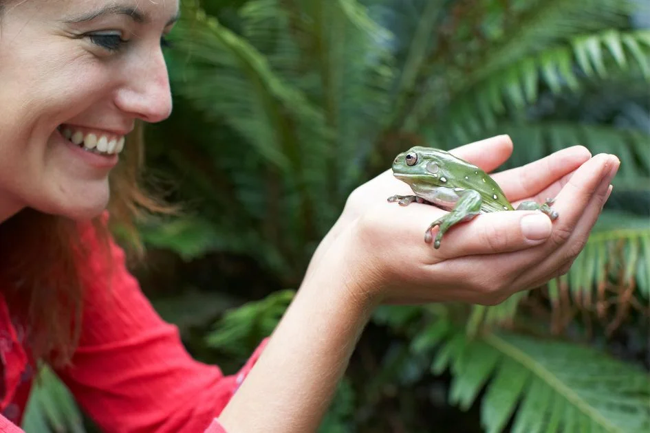 Woman Holding Frog Smiling